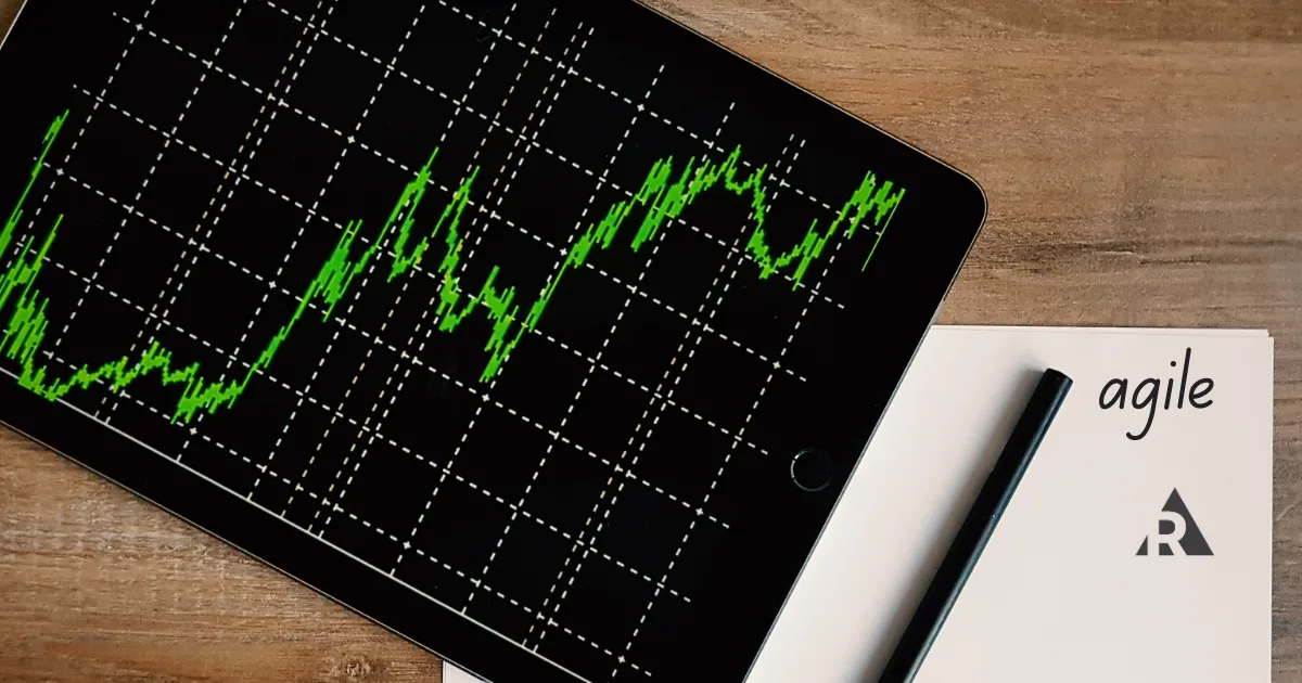 laptop with graphs and notepad