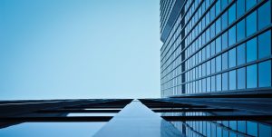 low angle view of office building against clear sky 258160 scaled e1593120654607