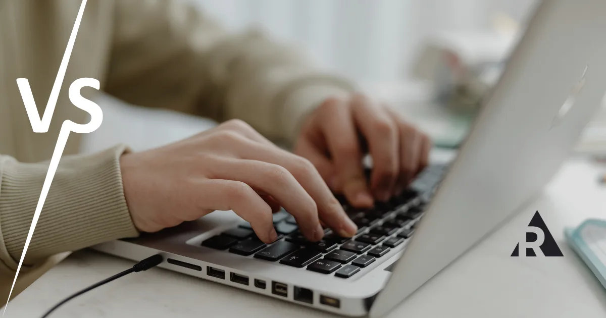 Hands typing on a laptop keyboard with a stylized "VS" graphic overlay