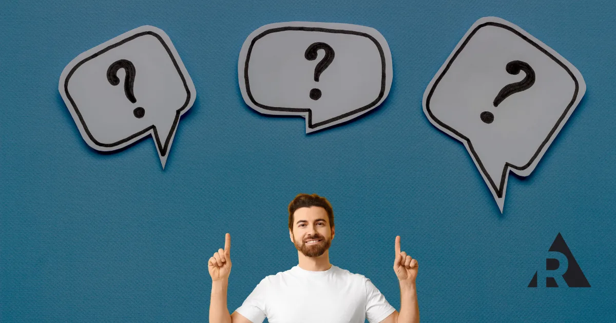 Man pointing up to question marks