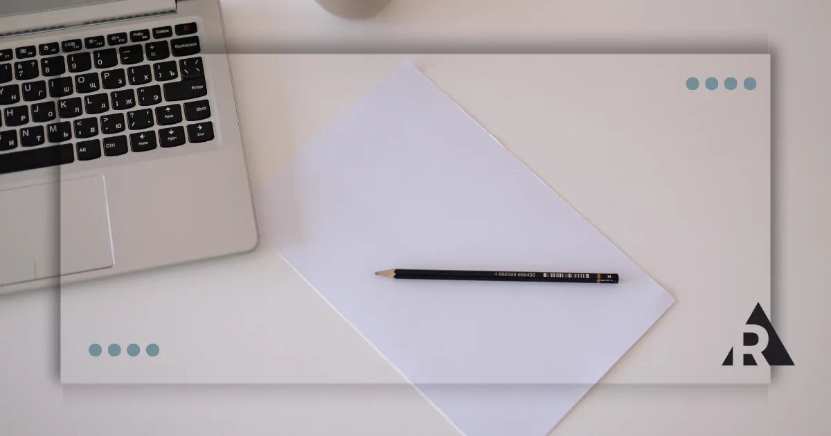 Pen and paper with a laptop
